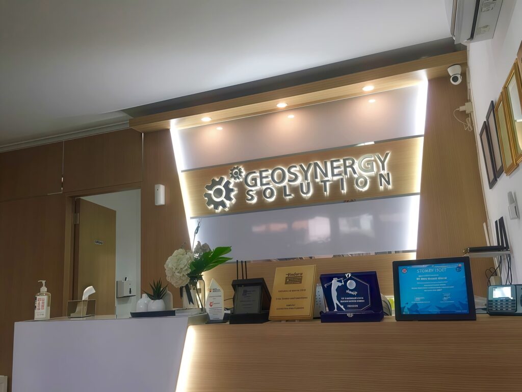 Office of PT Geo Sinergi Utama with company logo on the wall