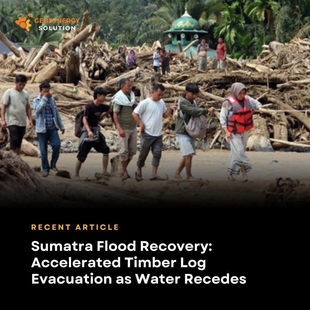 Recovery teams removing timber logs after floodwaters recede in Sumatra